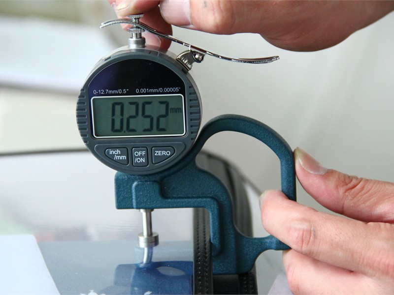 Thickness checking during custom menu cover quality control